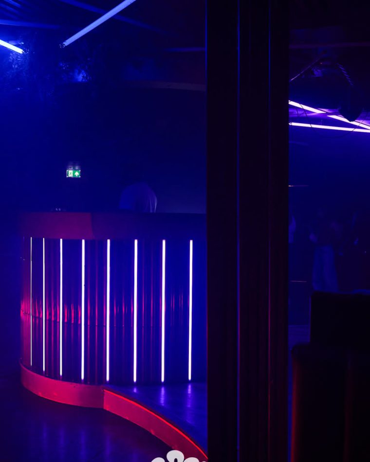 The curved bar counter at Cabo picked out in vertical neon strips.
